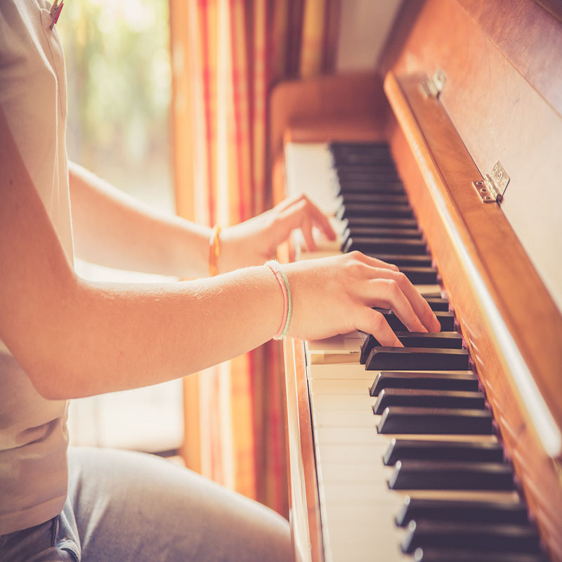Hands playing piano