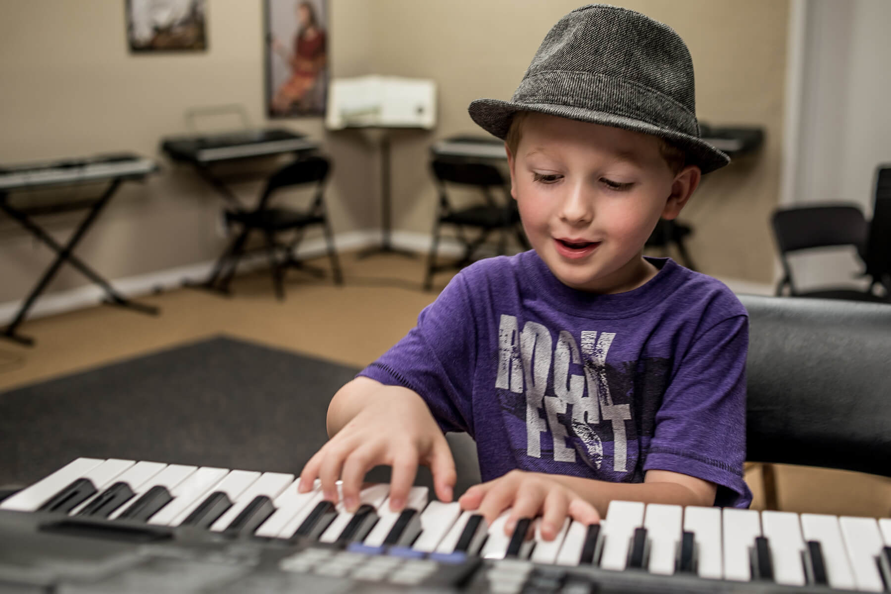 Young student playing keyboard
