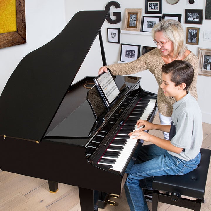 Student at keyboard lesson